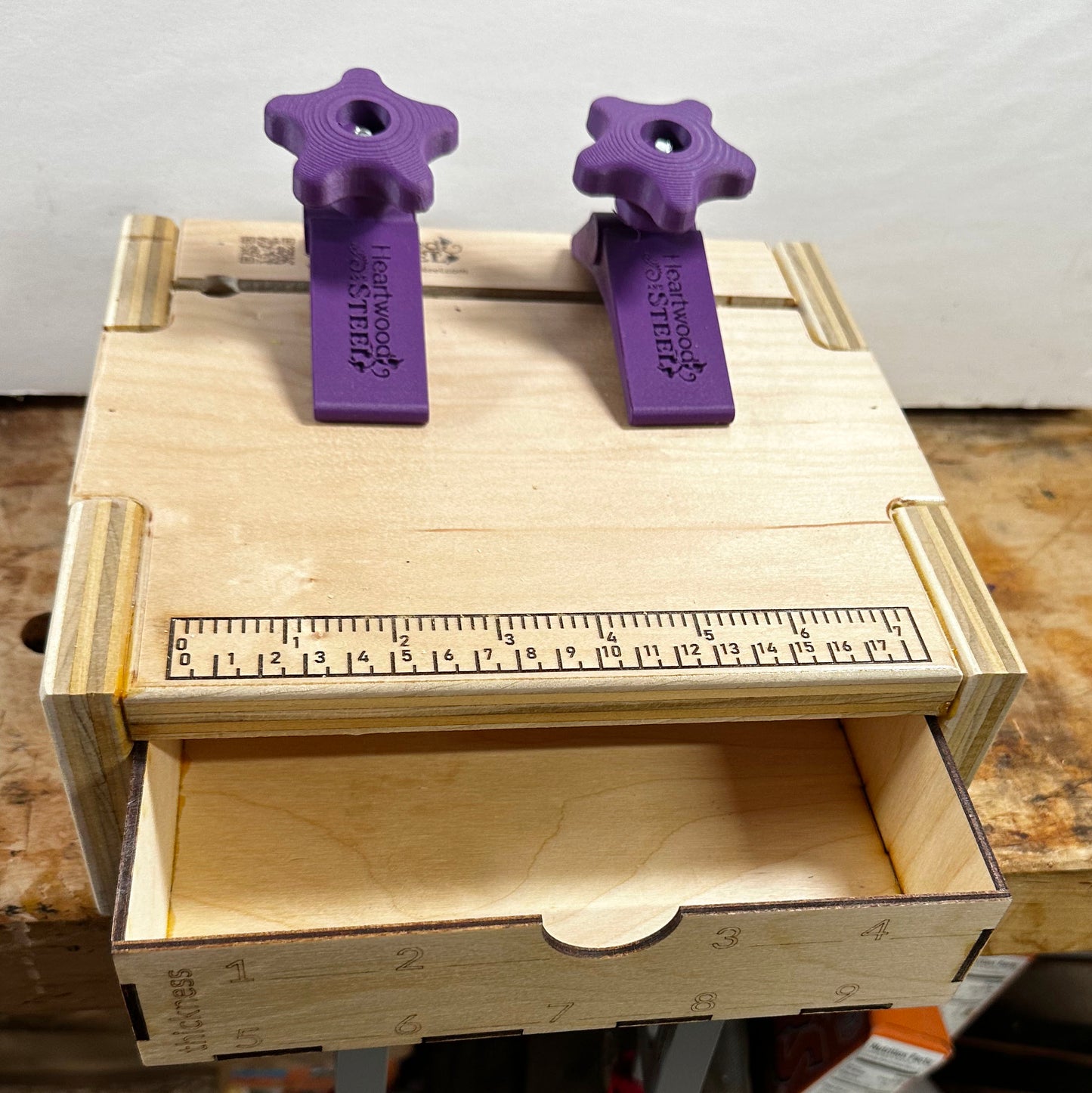The pasta machine base with an open utility drawer.